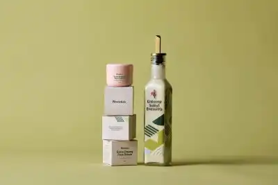 Nando's Extra creamy face cream stacked on packaging next to Creamy Salad Dressing